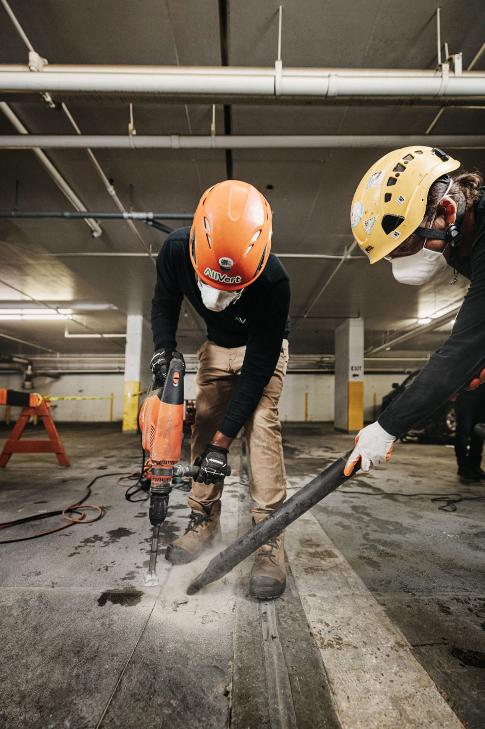 AllVert employees performing parkade maintenance