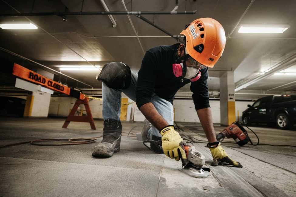 AllVert worker performing parkade maintenance