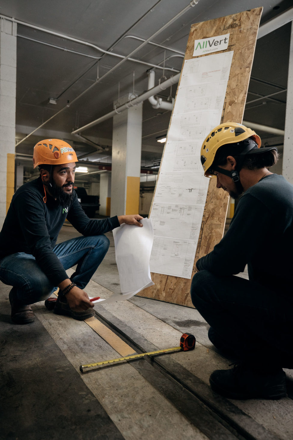 AllVert workers examining project plans